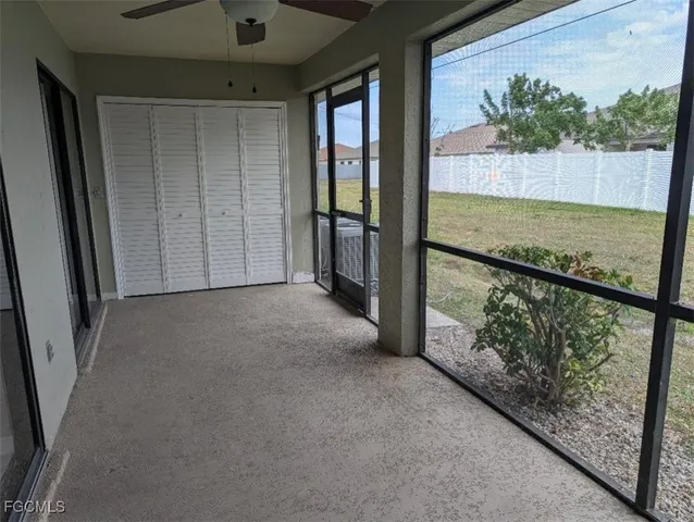a view of a room with wooden floor and staircase