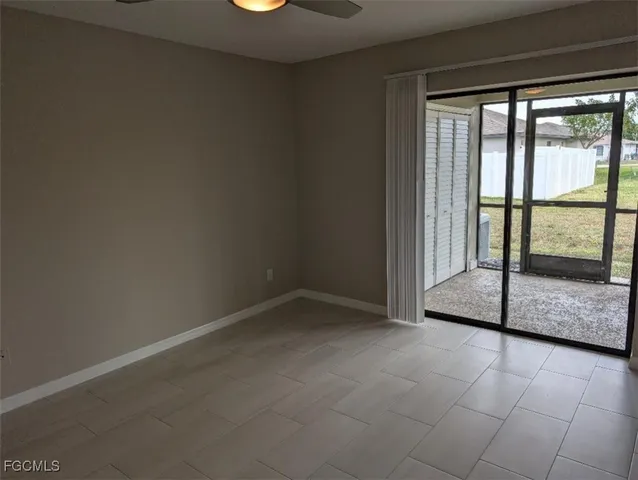 an empty room with sliding glass door