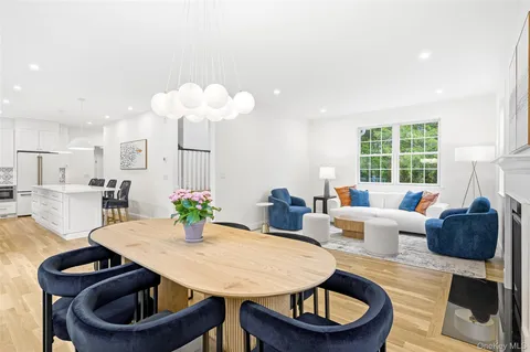 a living room with furniture a window and a table