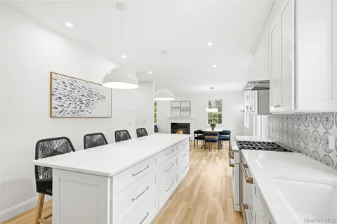a view of living room with granite countertop furniture and a fireplace
