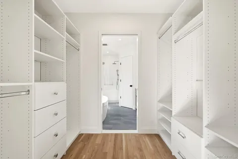 a bathroom with a sink and a glass door shower