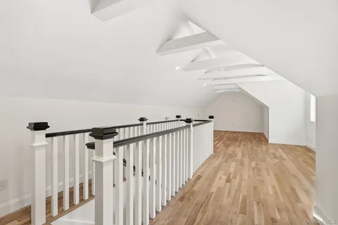 a view of a hallway with stairs