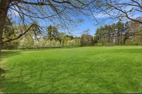 a backyard of a house with lots of green space