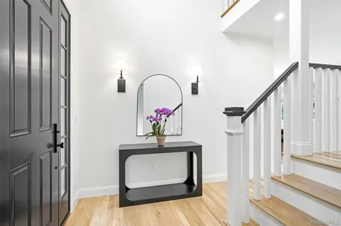 a view of hall way with mirror