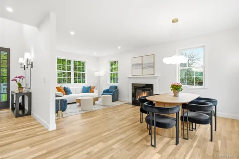 a view of a livingroom with furniture and a fireplace