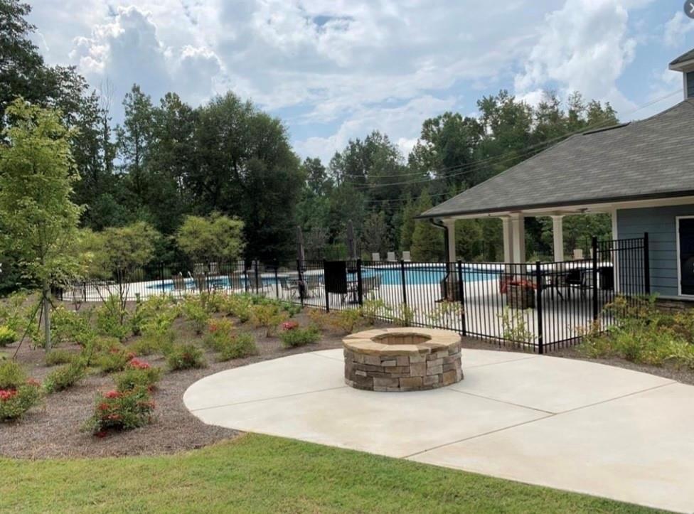 2979 Morgan Spring Trail Buford, GA 30519 - Photo 13 of 21 a view of a patio with table and chairs potted plants with wooden fence