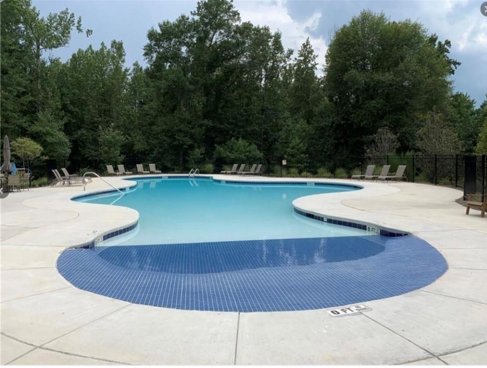 2979 Morgan Spring Trail Buford, GA 30519 - Photo 14 of 21 a view of a swimming pool with a yard