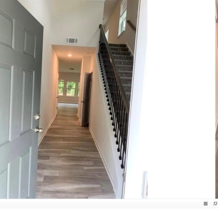 2979 Morgan Spring Trail Buford, GA 30519 - Photo 2 of 21 a view of a hallway with wooden floor