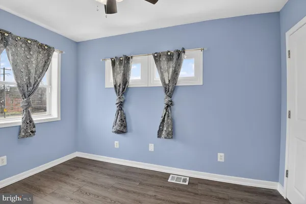 a view of entryway with wooden floor