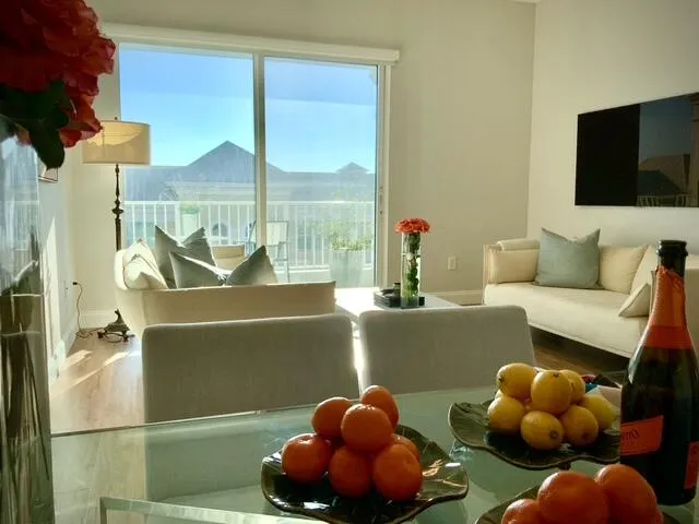 a room with furniture and a floor to ceiling window