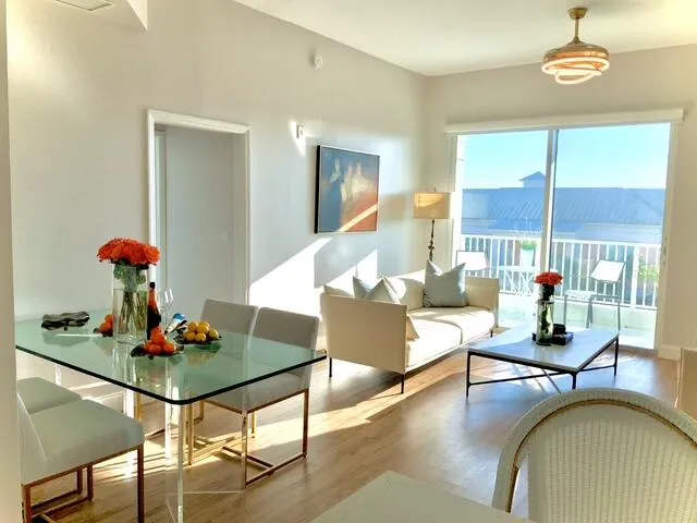 a living room with furniture and chandelier