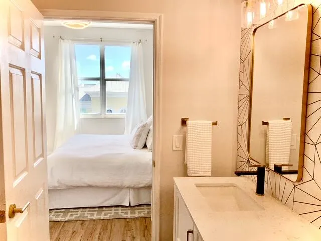 a bathroom with a sink toilet and mirror