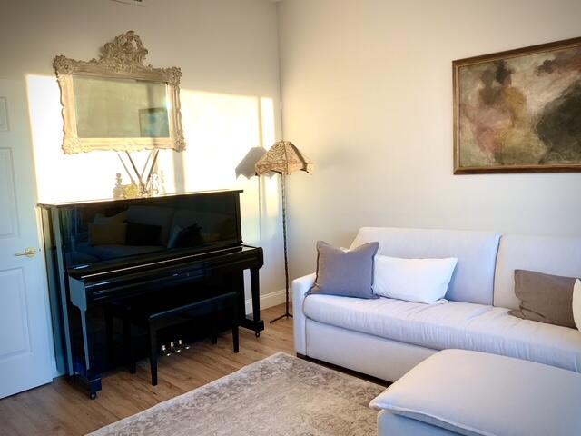 804 East Windward Way, Unit PH 21 Lantana, FL 33462 - Photo 25 of 46 a living room with furniture and a flat screen tv