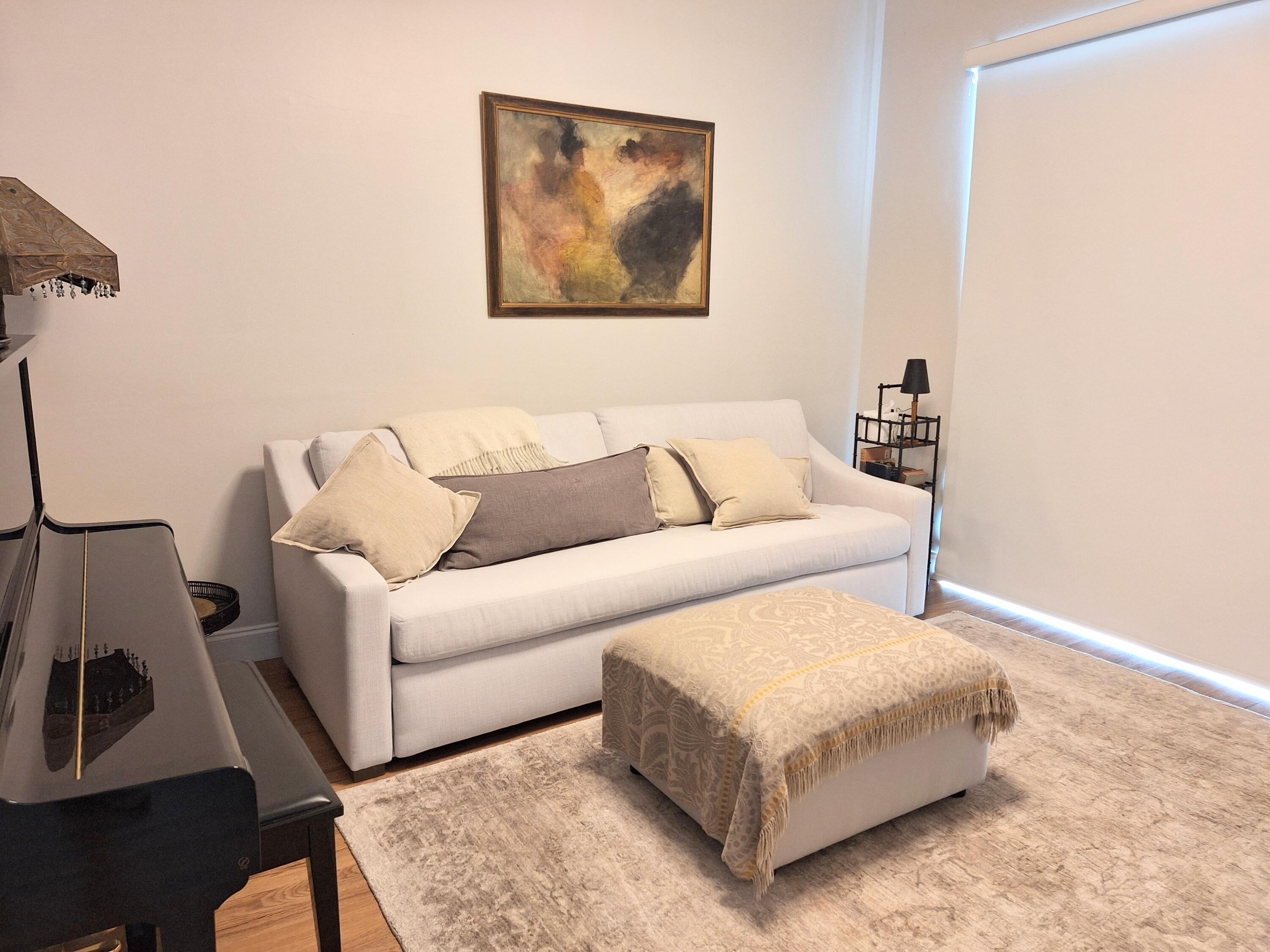 804 East Windward Way, Unit PH 21 Lantana, FL 33462 - Photo 26 of 46 a living room with a couch