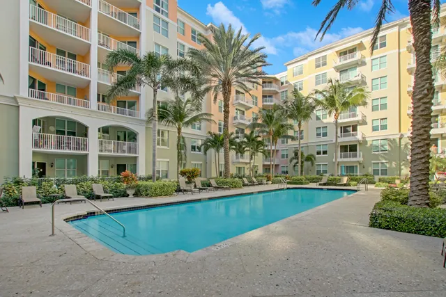 a swimming pool view with a garden
