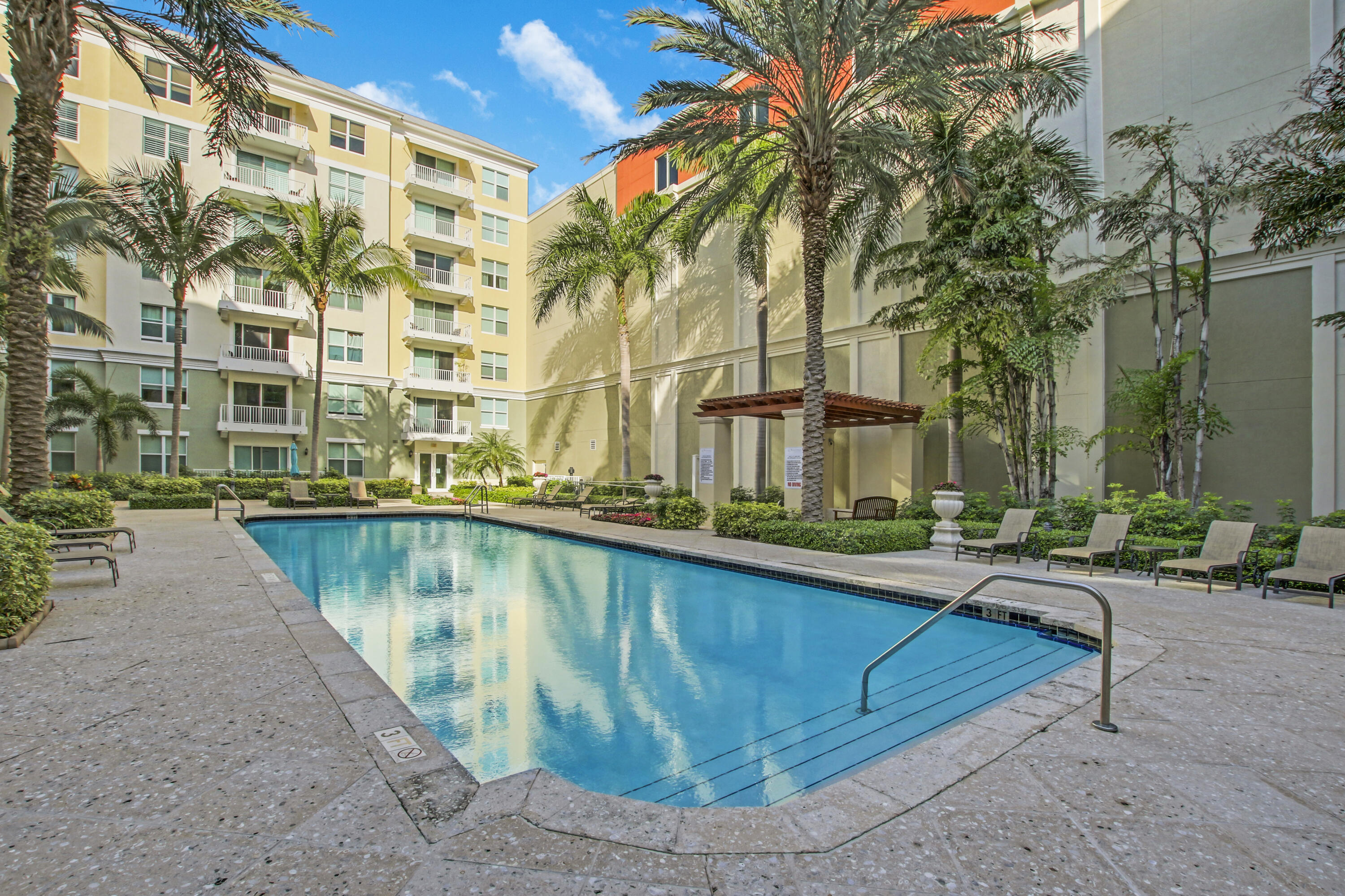 804 East Windward Way, Unit PH 21 Lantana, FL 33462 - Photo 34 of 46 a view of a swimming pool with a patio