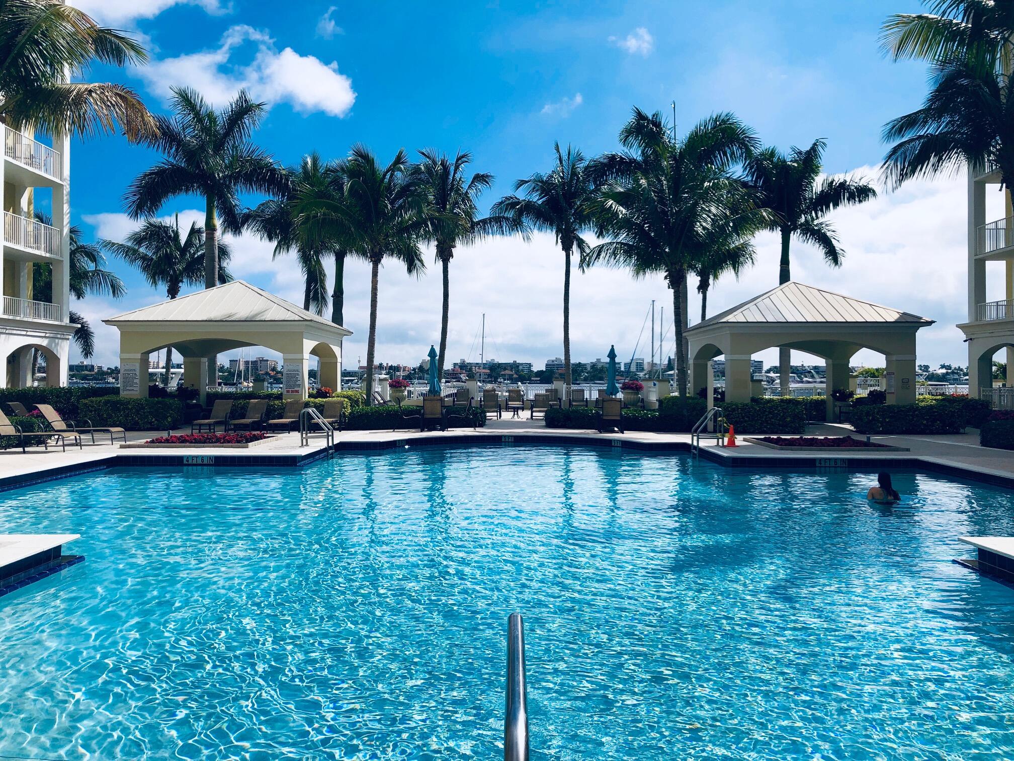 804 East Windward Way, Unit PH 21 Lantana, FL 33462 - Photo 35 of 46 a swimming pool view with a garden