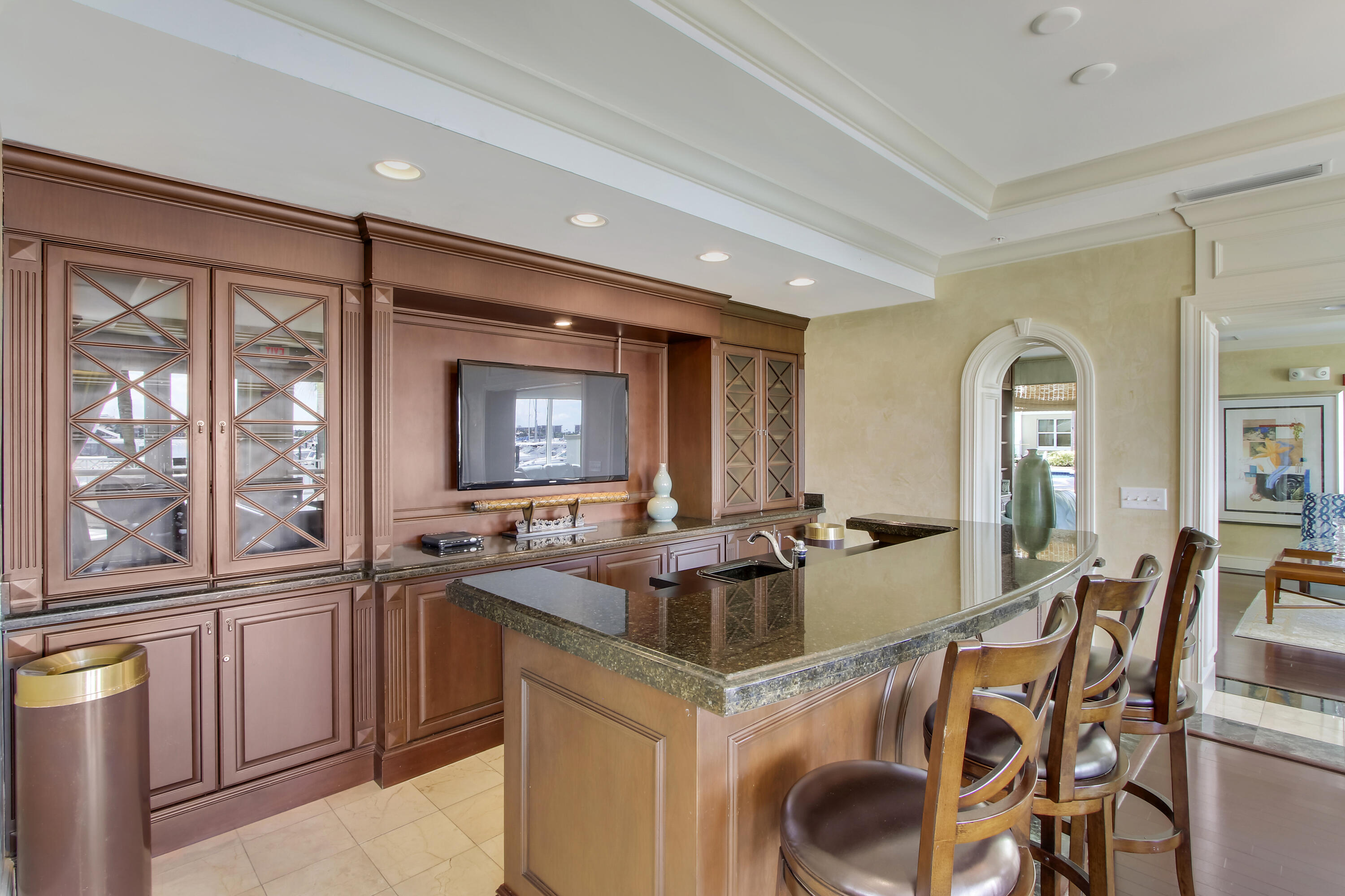 804 East Windward Way, Unit PH 21 Lantana, FL 33462 - Photo 40 of 46 a kitchen that has a lot of cabinets a sink and appliances in it