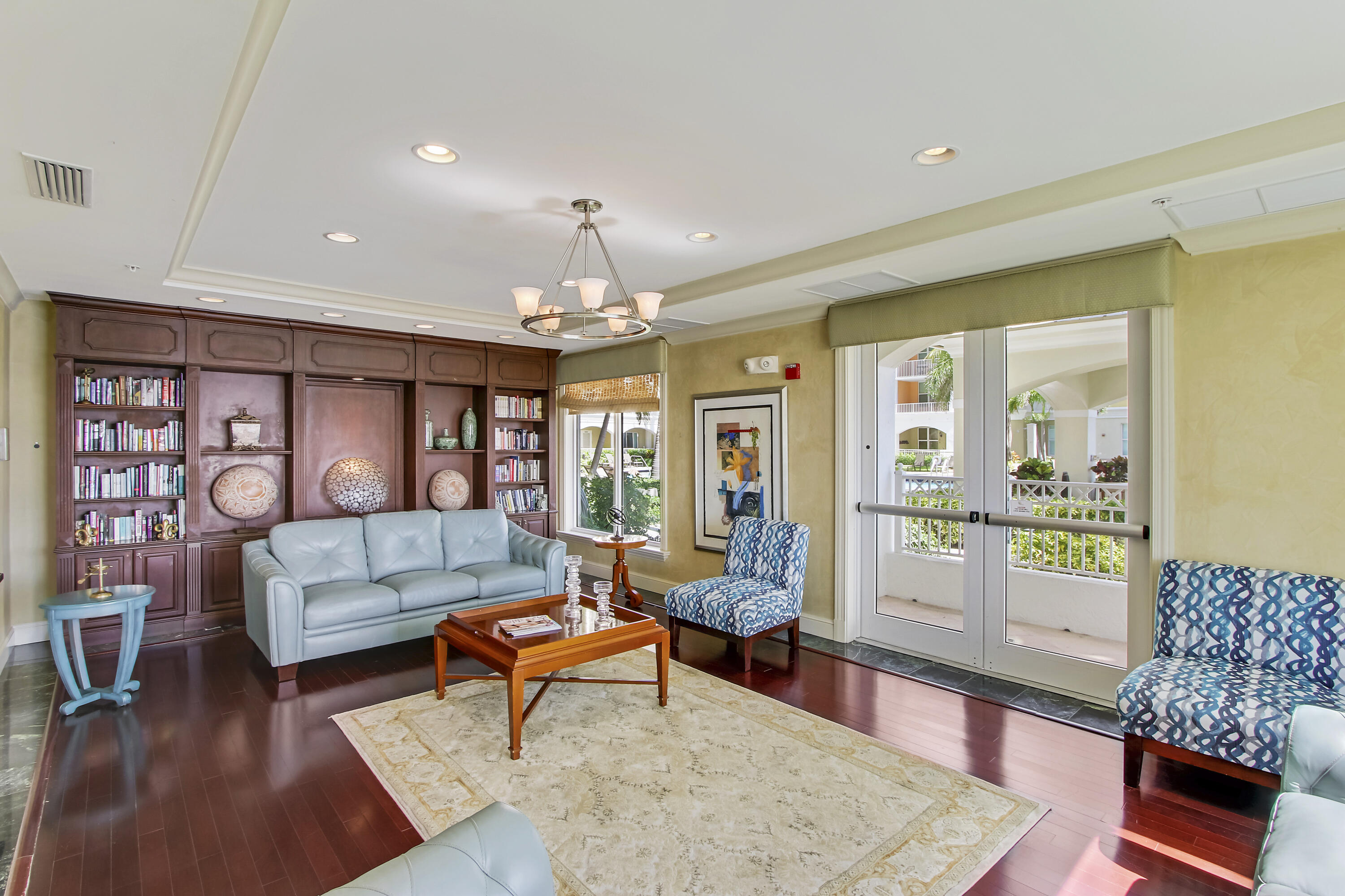 804 East Windward Way, Unit PH 21 Lantana, FL 33462 - Photo 41 of 46 a living room with furniture and a chandelier