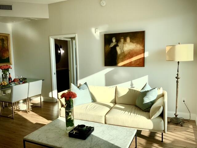 804 East Windward Way, Unit PH 21 Lantana, FL 33462 - Photo 5 of 46 a living room with furniture and a flat screen tv