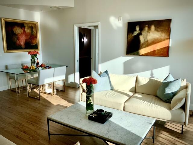 804 East Windward Way, Unit PH 21 Lantana, FL 33462 - Photo 6 of 46 a living room with furniture and painting on the wall