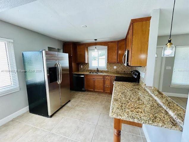 3147 Trevino Terrace, Unit 1 Punta Gorda, FL 33983 - Photo 11 of 48 a kitchen with refrigerator and window