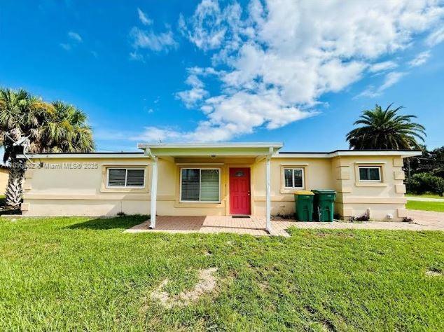 3147 Trevino Terrace, Unit 1 Punta Gorda, FL 33983 - Photo 2 of 48 a front view of house with yard and green space