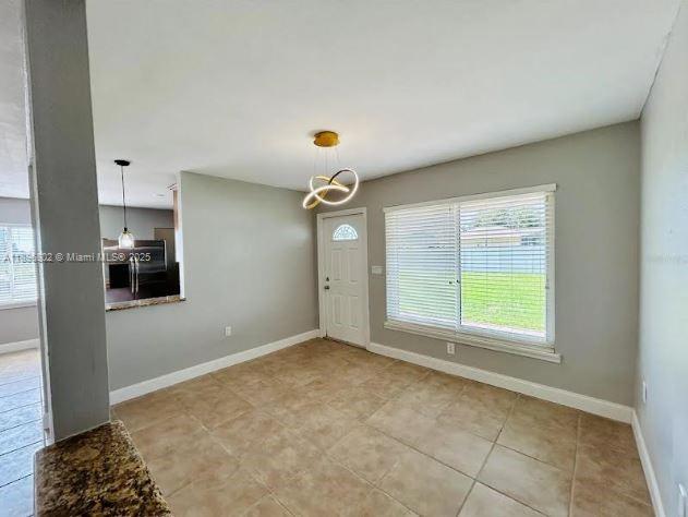3147 Trevino Terrace, Unit 1 Punta Gorda, FL 33983 - Photo 21 of 48 a view of an empty room with a window