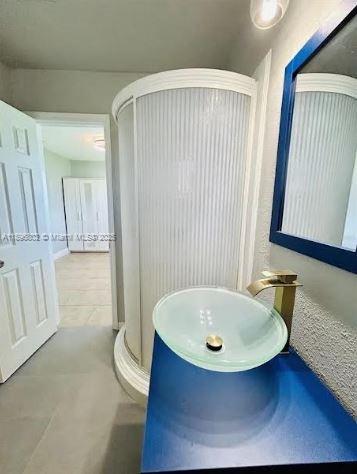 3147 Trevino Terrace, Unit 1 Punta Gorda, FL 33983 - Photo 23 of 48 a bathroom with a tub and a sink