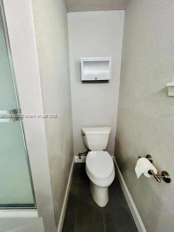 3147 Trevino Terrace, Unit 1 Punta Gorda, FL 33983 - Photo 24 of 48 a white toilet sitting next to a shower