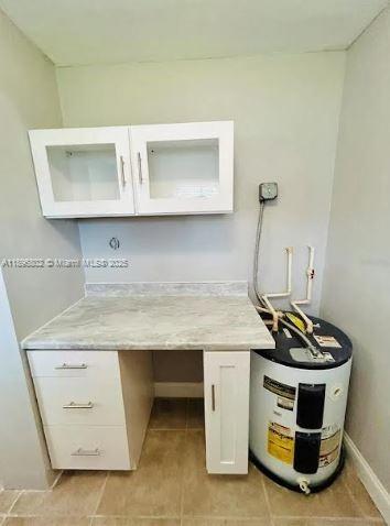 3147 Trevino Terrace, Unit 1 Punta Gorda, FL 33983 - Photo 29 of 48 a room with kitchen island a stove and a sink