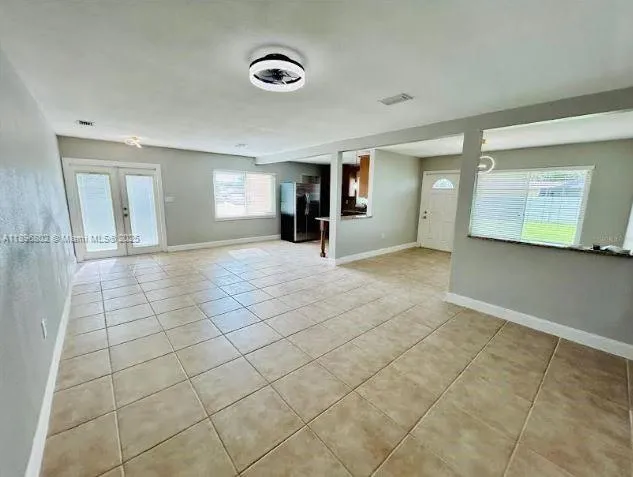 a view of a livingroom with an empty space and window