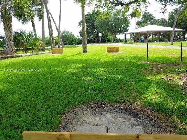 3147 Trevino Terrace, Unit 1 Punta Gorda, FL 33983 - Photo 43 of 48 a view of yard with swimming pool and green space