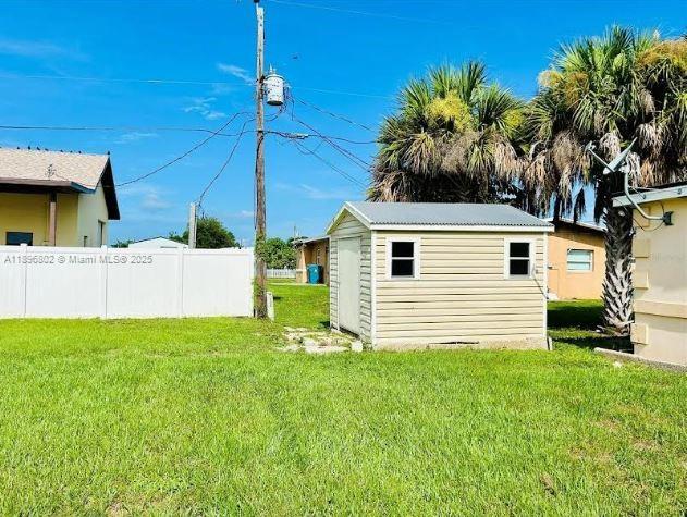 3147 Trevino Terrace, Unit 1 Punta Gorda, FL 33983 - Photo 46 of 48 a view of a house with a yard