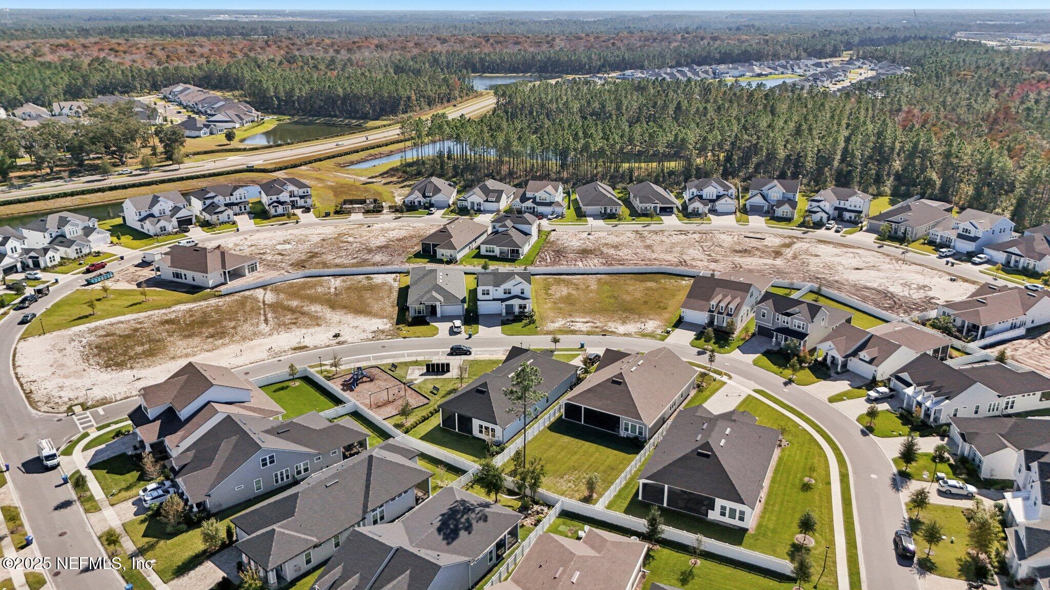 112 Rose Bud Lane St. Augustine, FL 32092 - Photo 14 of 66 an aerial view of a house with a swimming pool patio and mountain view