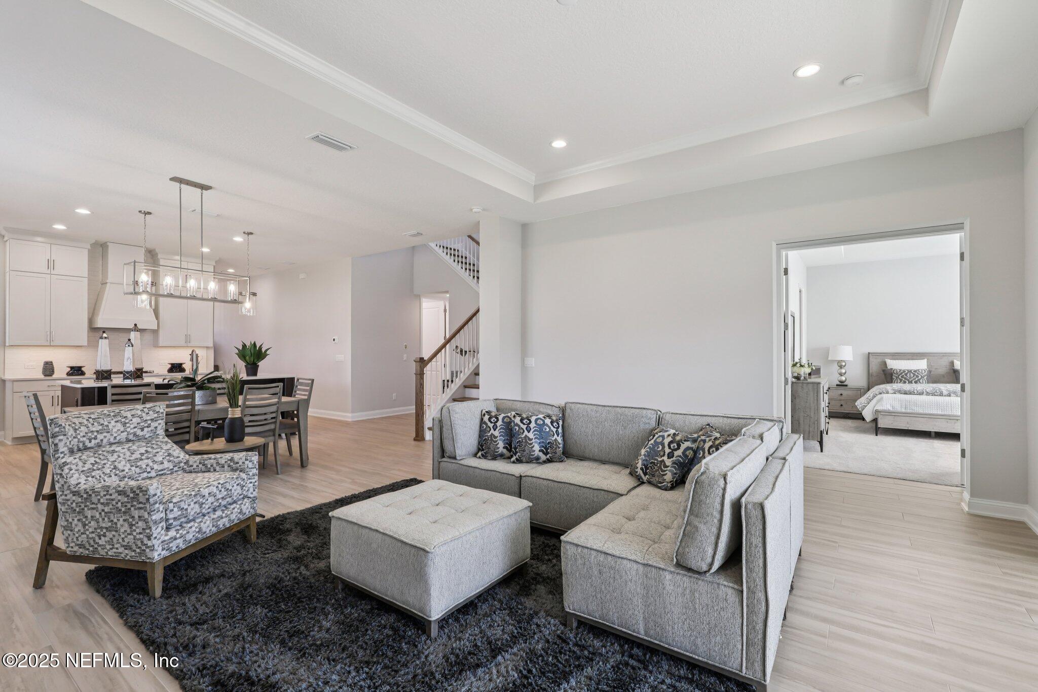 112 Rose Bud Lane St. Augustine, FL 32092 - Photo 23 of 66 a living room with furniture and a table