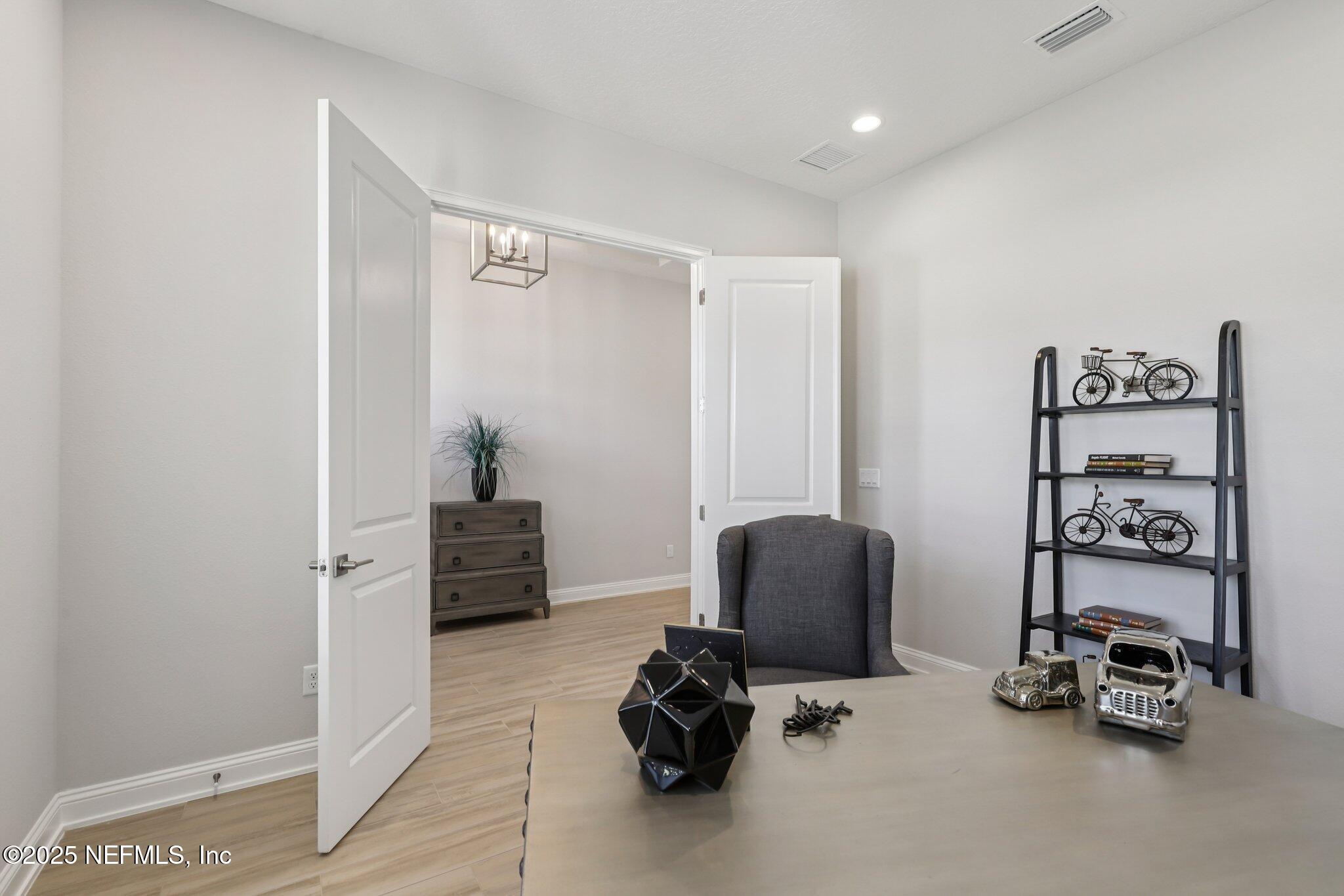 112 Rose Bud Lane St. Augustine, FL 32092 - Photo 35 of 66 a room with chair and gym equipment