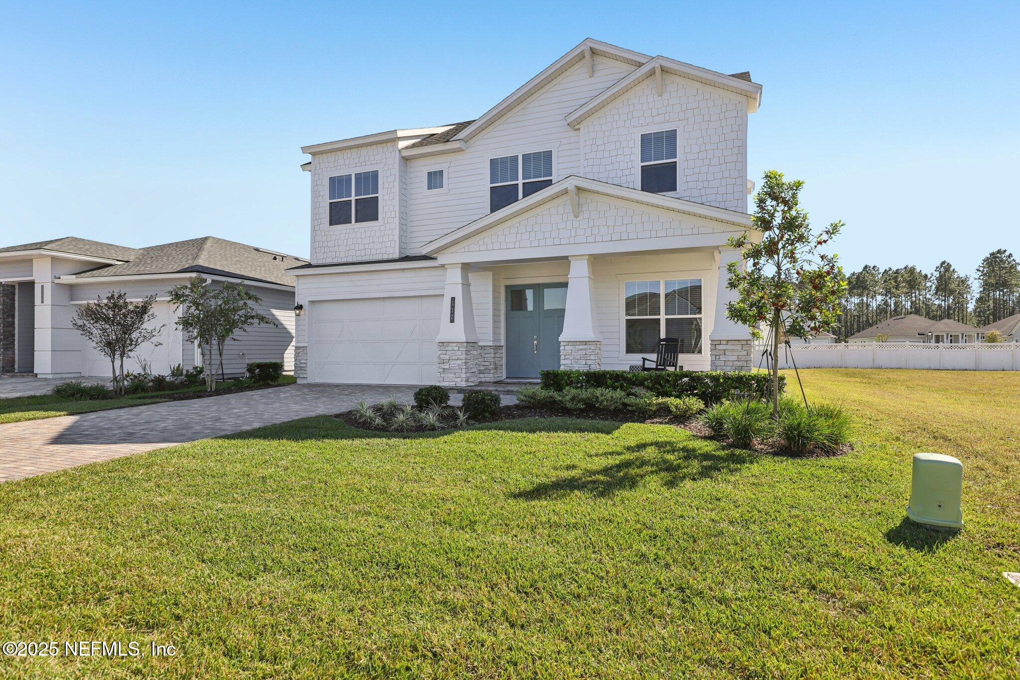112 Rose Bud Lane St. Augustine, FL 32092 - Photo 5 of 66 a front view of a house with a yard