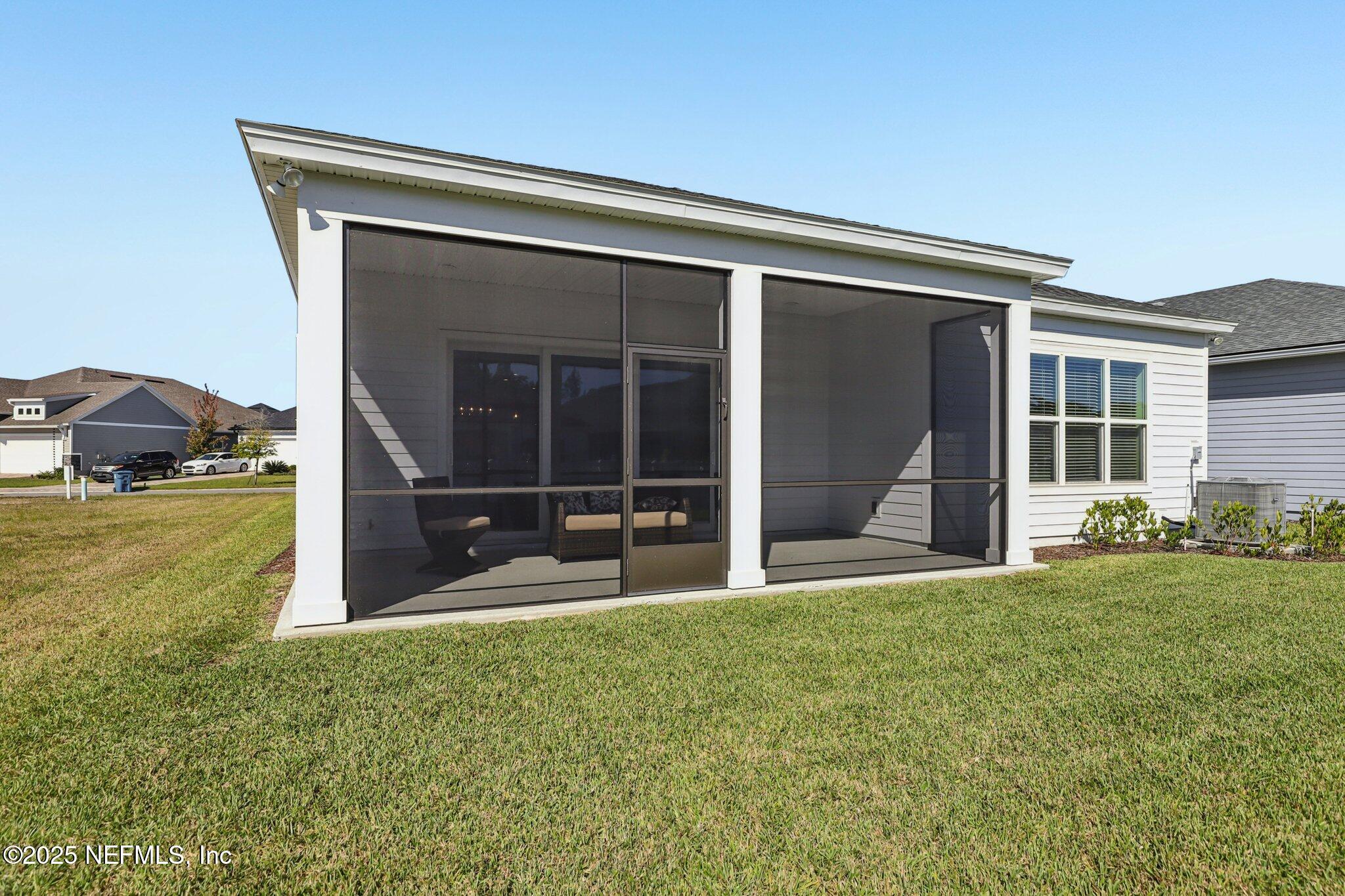 112 Rose Bud Lane St. Augustine, FL 32092 - Photo 57 of 66 a view of a house with backyard