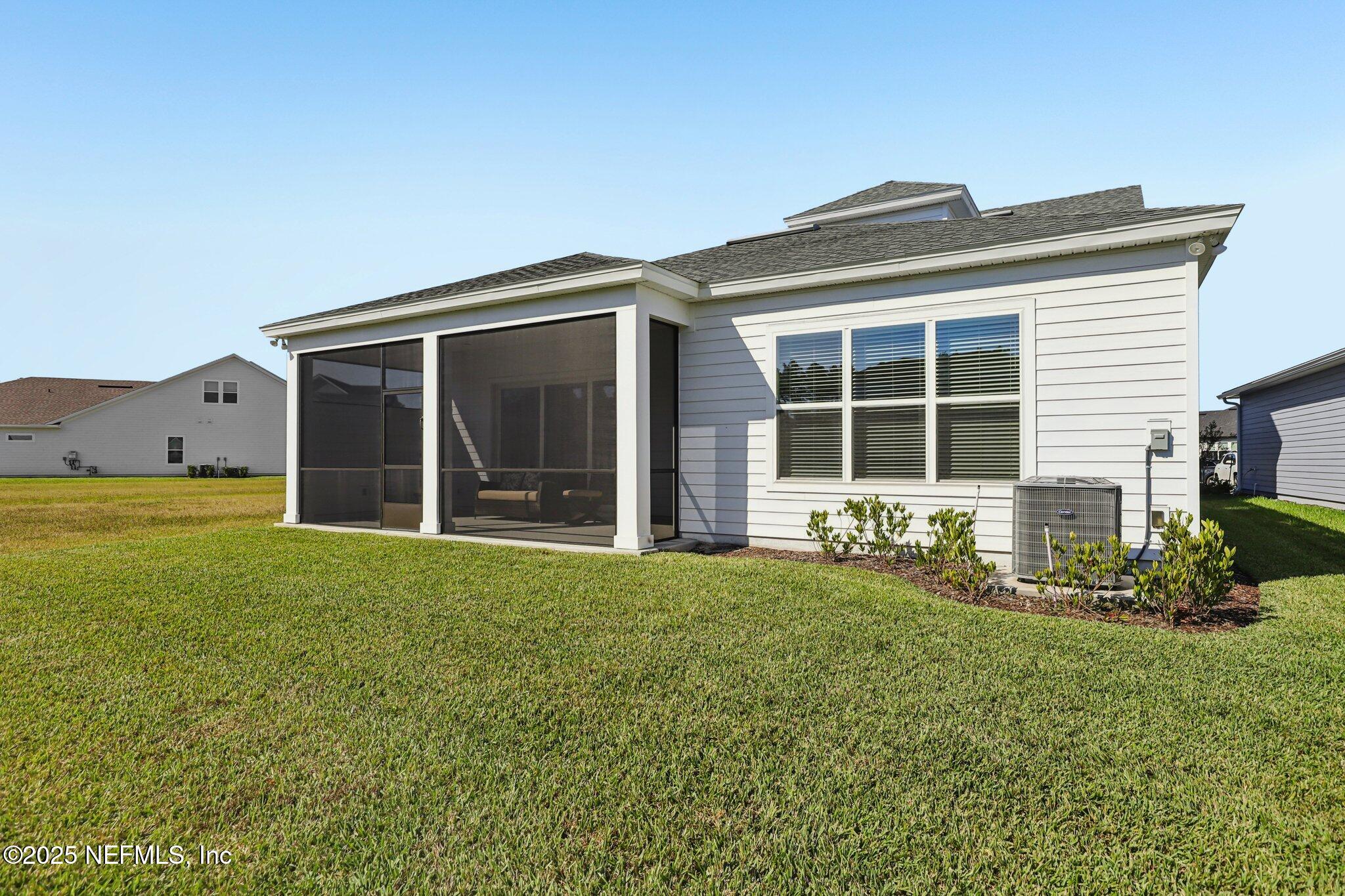 112 Rose Bud Lane St. Augustine, FL 32092 - Photo 59 of 66 a front view of a house with a garden