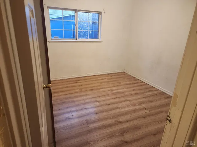 a bathroom with a sink mirror vanity and toilet