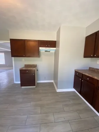 a view of kitchen with wooden floor