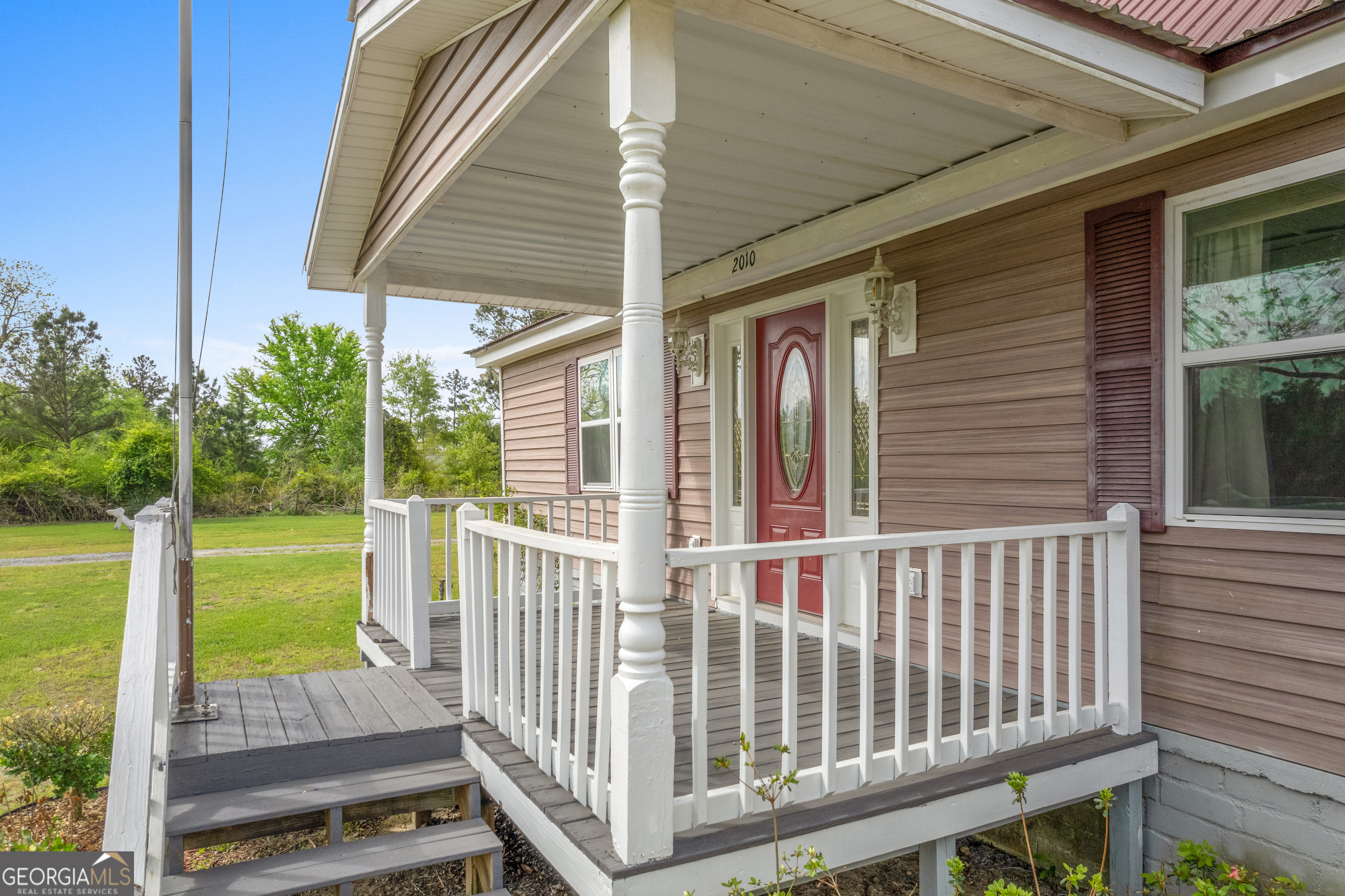 2010 Page Road Harrison, GA 31035 - Photo 16 of 59 a view of a porch with a yard