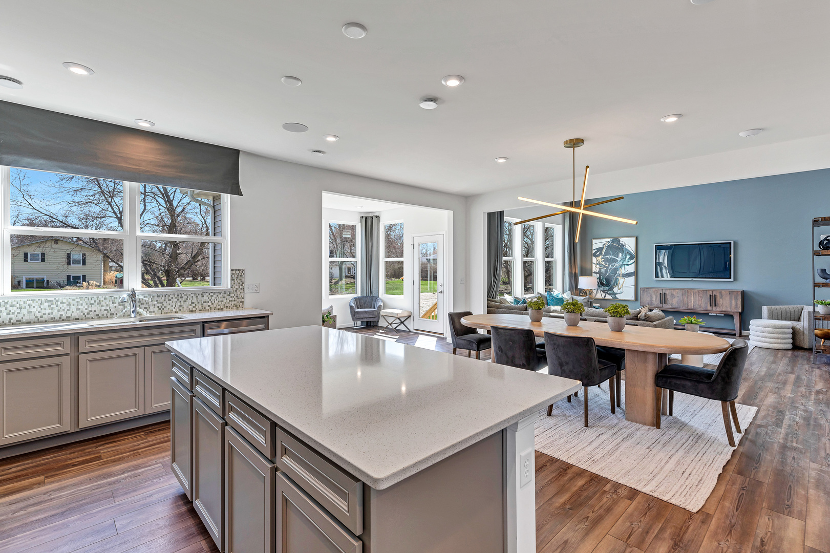 2416 Lucent Lane Naperville, IL 60563 - Photo 11 of 20 a large kitchen with kitchen island a sink table and chairs