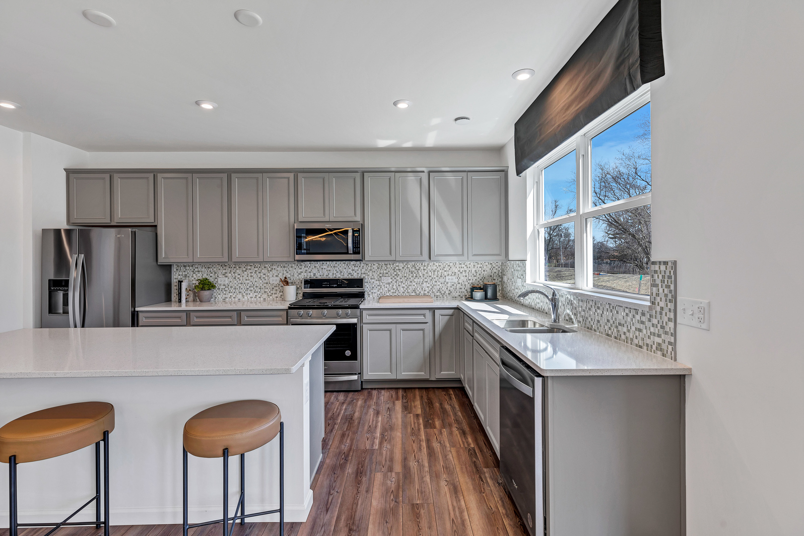 2416 Lucent Lane Naperville, IL 60563 - Photo 9 of 20 a kitchen with stainless steel appliances granite countertop a stove refrigerator sink and cabinets