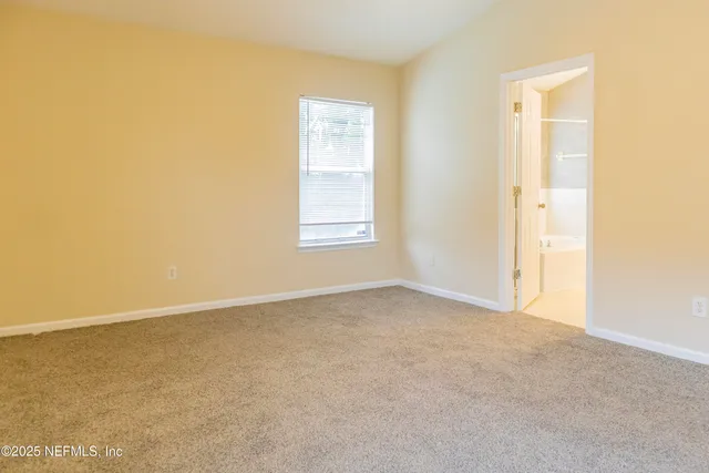 a bathroom with a tub sink and a mirror