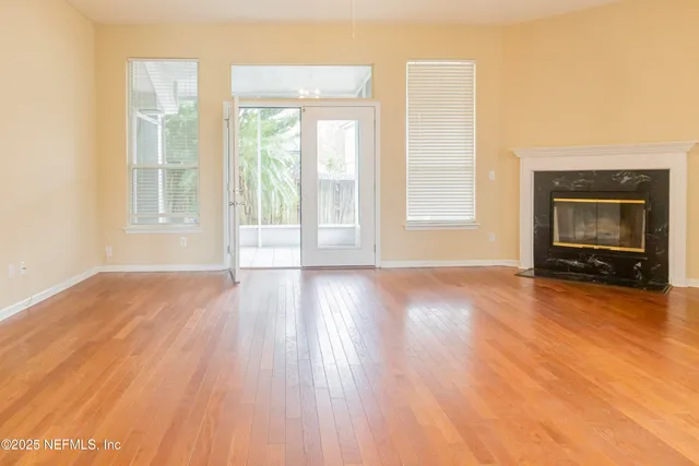 a bathroom with a tub mirror and window
