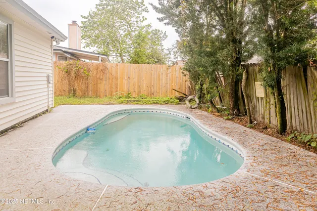 a view of a kitchen cabinets wooden floor and a kitchen