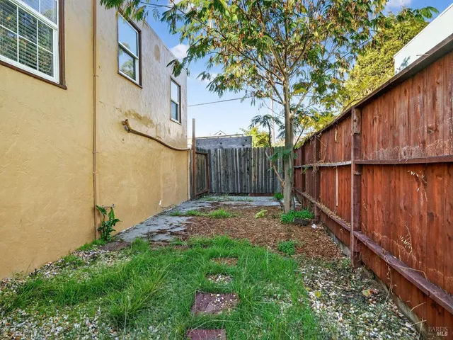 a view of livingroom with stairs and toys