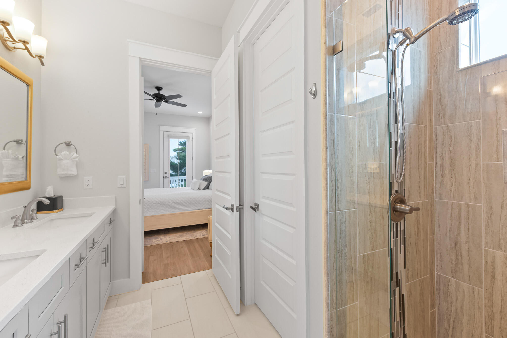 500 Gulfview Circle Santa Rosa Beach, FL 32459 - Photo 57 of 69 a en suite bathroom with a double vanity sink a mirror and a shower
